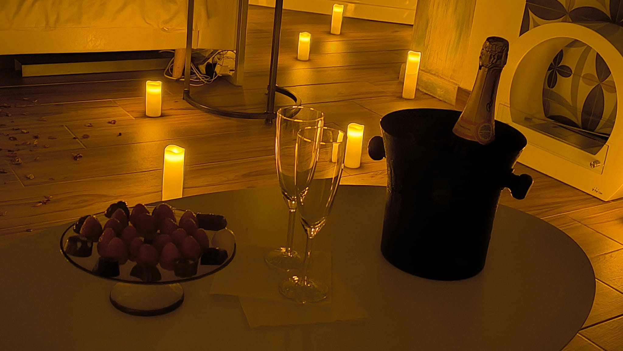 Champagne, strawberries and chocolates prepared for a romantic proposal in the dome