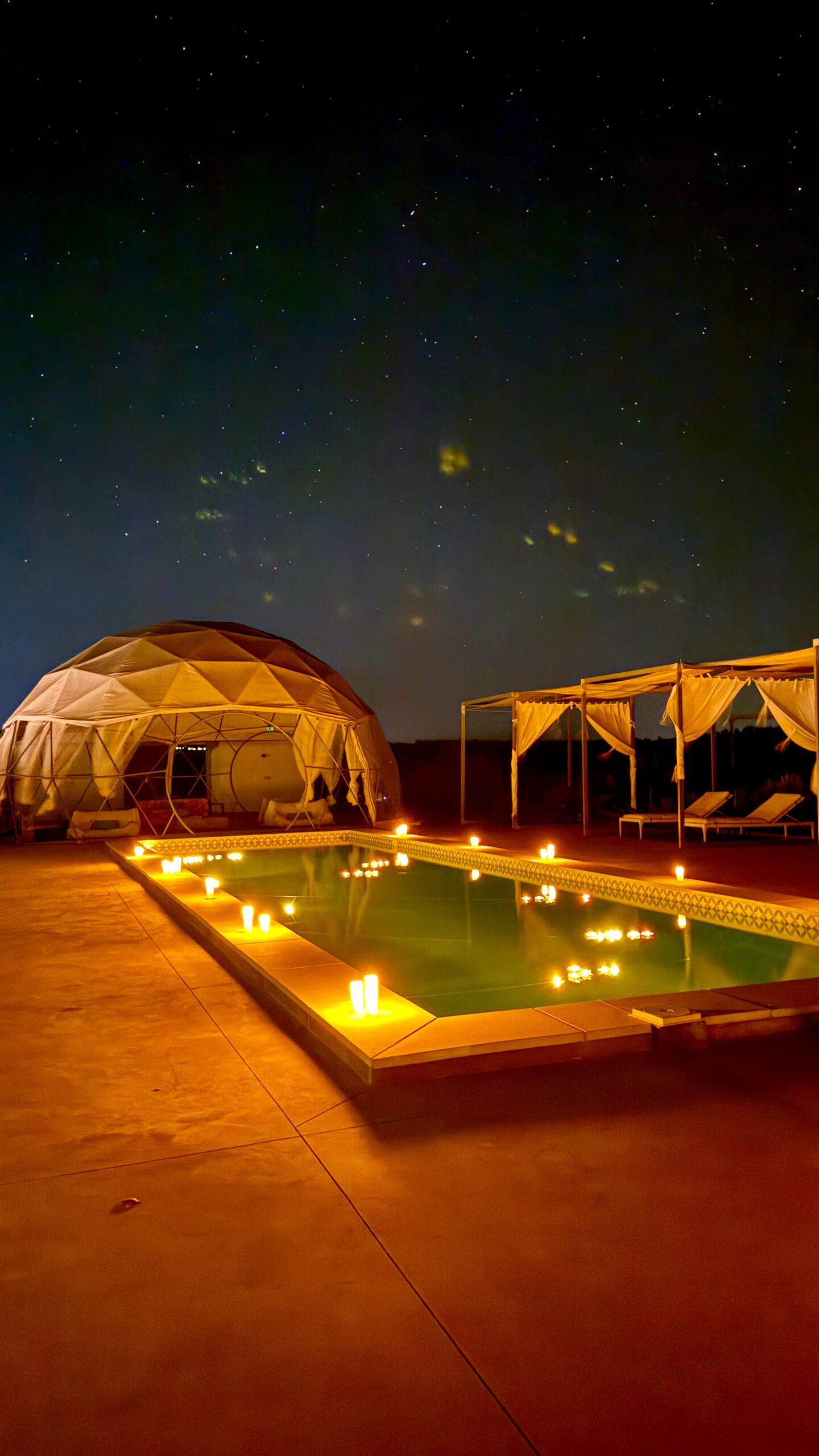 Geodesic dome and candlelit pool under a starry Alentejo sky, set for a proposal