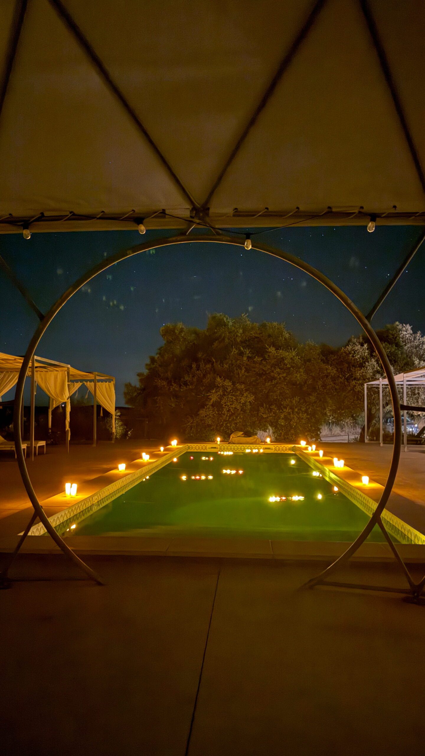 Panoramic view of the candlelit pool under the stars in Veiros, Alentejo